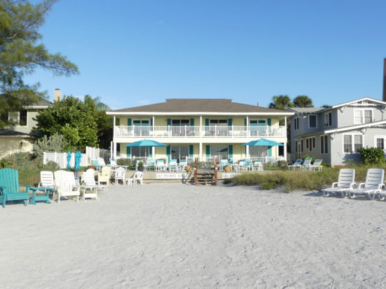 Villas overlook the white sand and gulf waters.